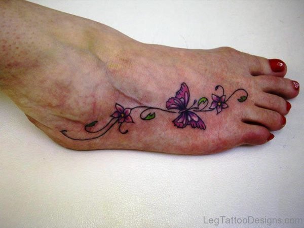 Lovely Flowers With Butterly Tattoo On Foot