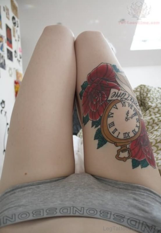 Lovely Rose And Clock Tattoo On Thigh
