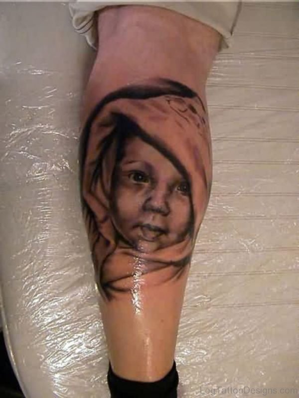 New Grey Ink Baby Portrait Tattoo On Leg