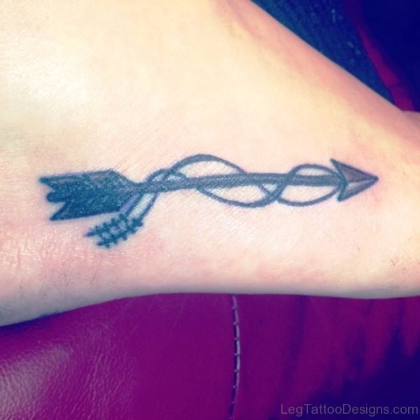 Nice Black Arrow Tattoo On Foot