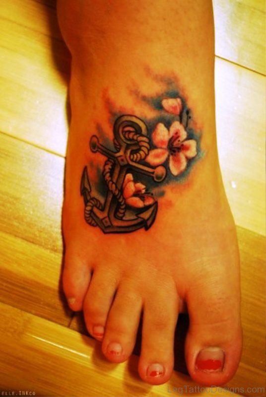 Nice Floral Anchor Tattoo On Foot