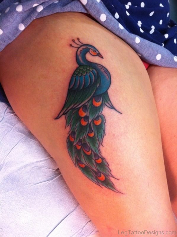 Nice Peacock Tattoo Design On Thigh