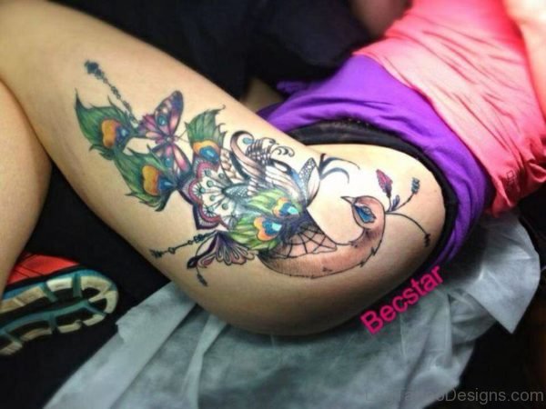 Nice Peacock Tattoo On Thigh