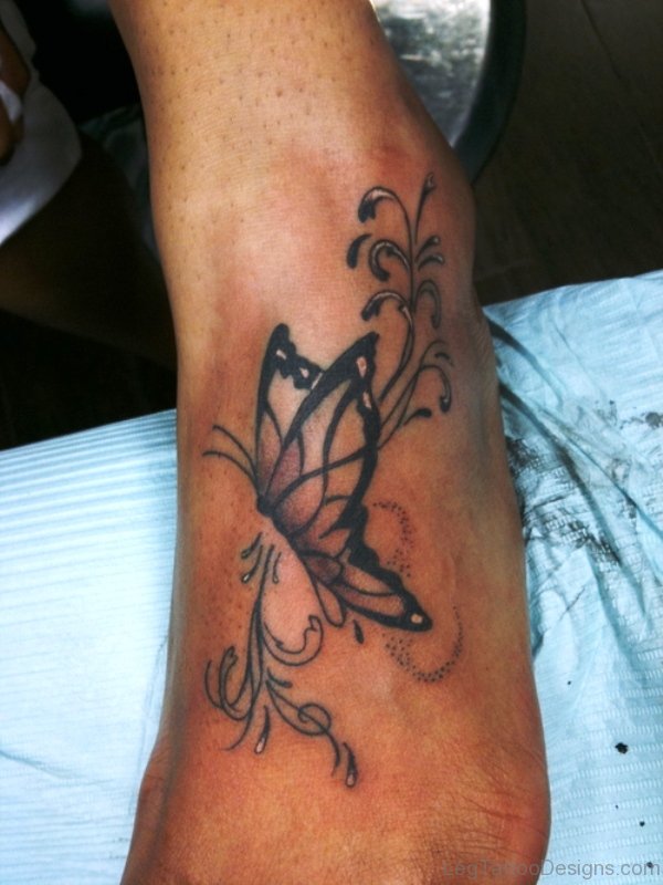 Nice Tribal Butterfly Tattoo On Foot