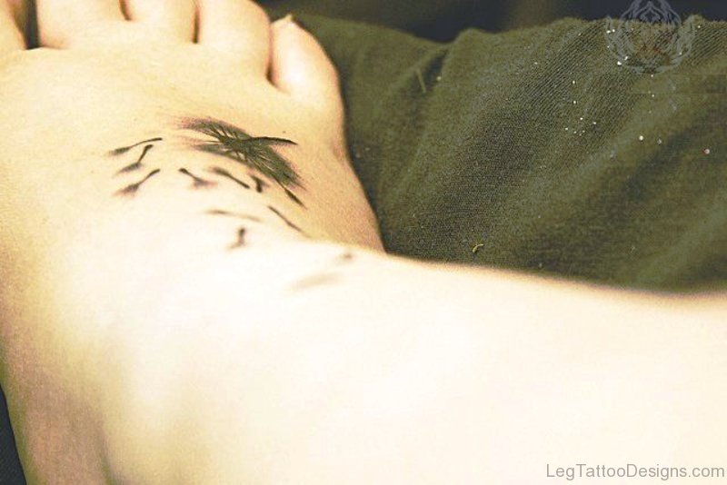 Photo Of Dandelion Tattoo On Foot