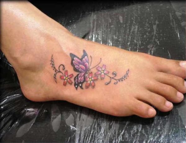 Purple Butterfly Tattoo With Flowers