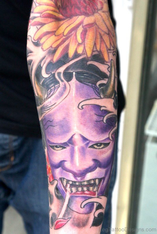Purple Color Evil Face Tattoo On Leg