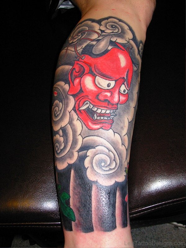 Red Faced Evil Tattoo On Leg