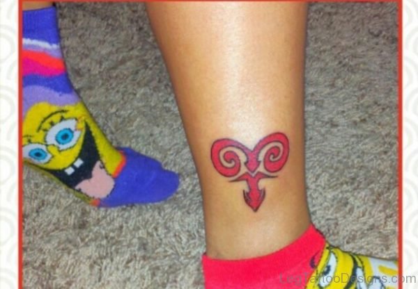 Red Ink Aries Tattoo On Ankle