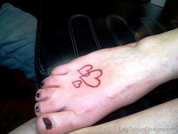 Red Ink Hearts Tattoo On Foot