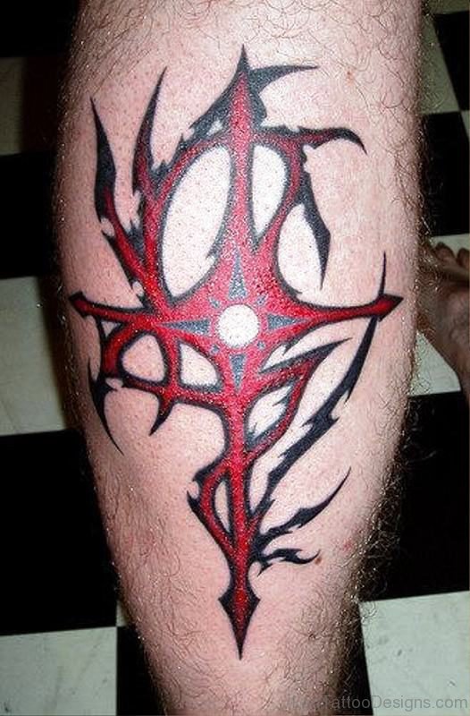 Red Inked Cross Tattoo On Leg