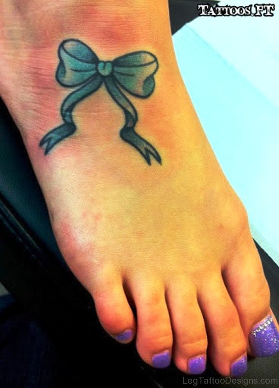 Sea Green Bow Tattoo On Foot