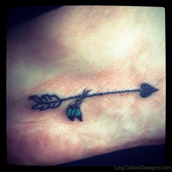 Simple Black Arrow Tattoo On Foot