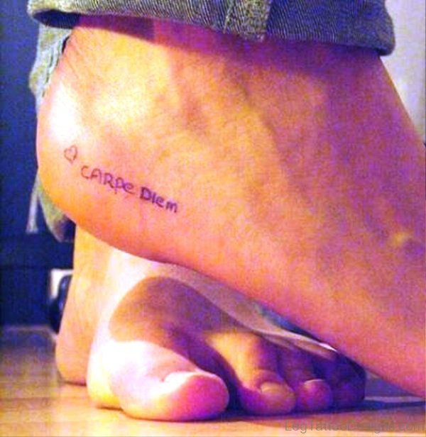 Simple Black Carpe Diem Tattoo On Foot