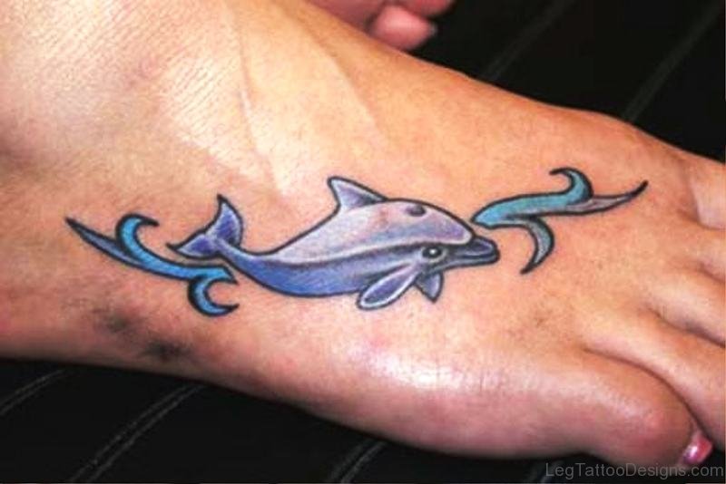 Small Blue Dolphin Tattoo On Foot