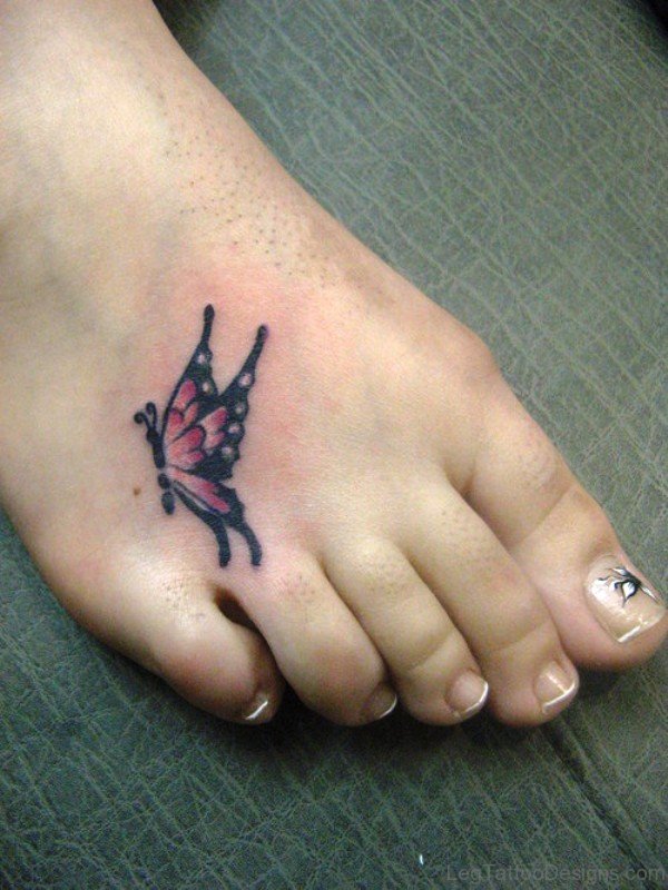 Small Pink And Black Butterfly Tattoo On Foot
