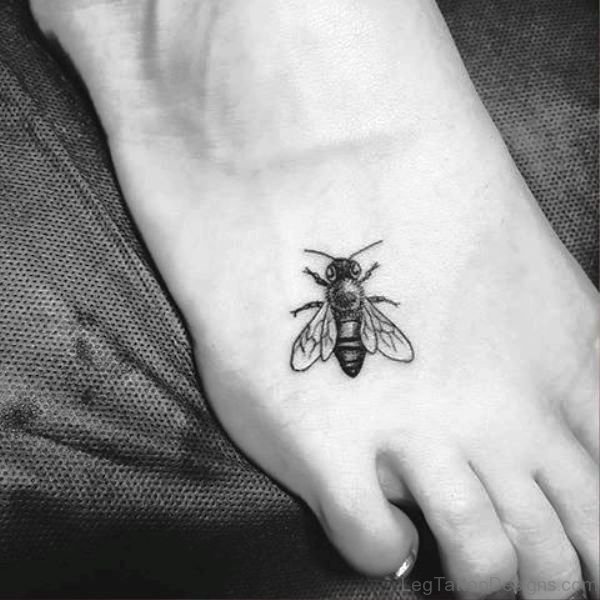 Tiny Black Bee Tattoo On Foot
