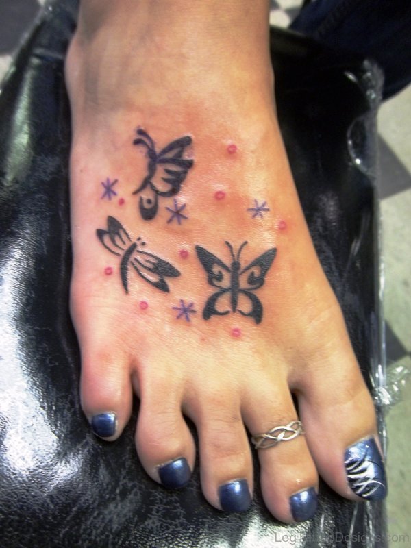 Tribal Butterflies Tattoo On Foot