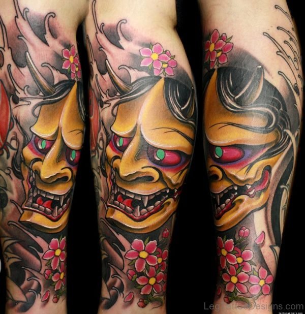 African Mask Tattoo On Leg