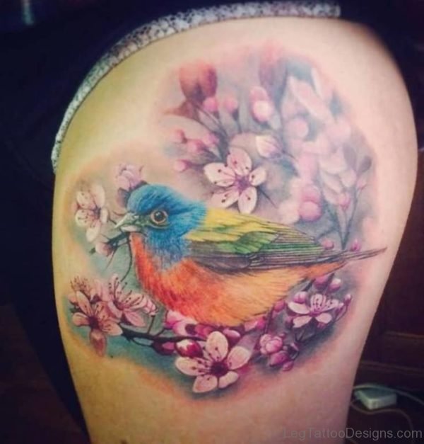 Attractive Bird And Aqua Flower Tattoo On Thigh