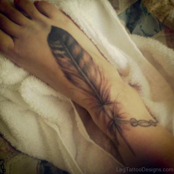 Black And Grey Feather Tattoo On Girl Right Foot
