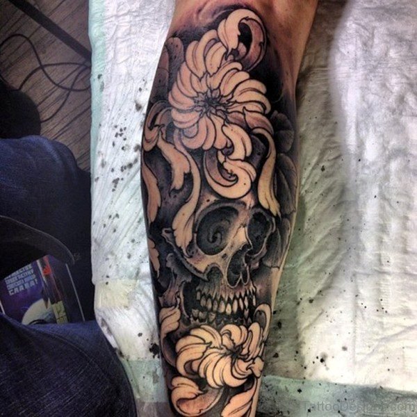 Black And Grey Skull With Flowers Tattoo Design For Leg