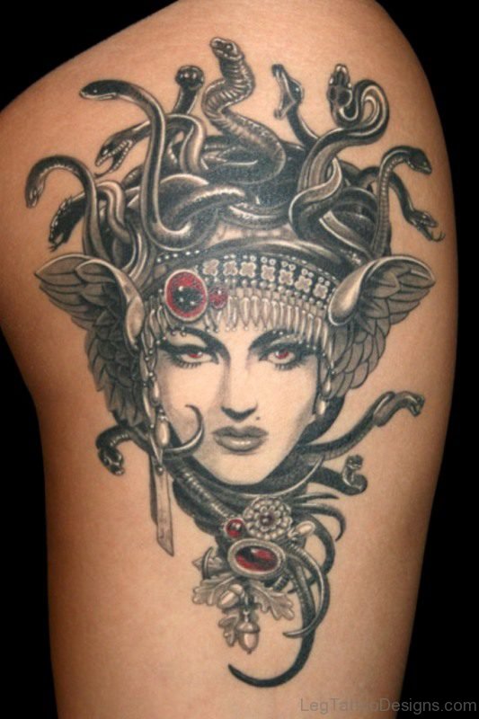Black And White Medusa Head Tattoo On Thigh