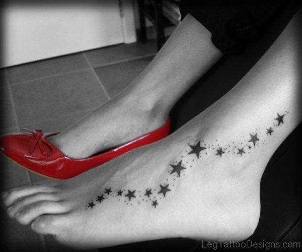 Black And White Stars Tattoo On Foot