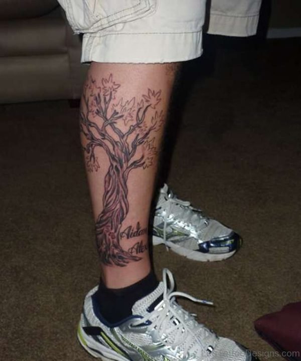 Black Ink Tree Tattoo On Right Leg