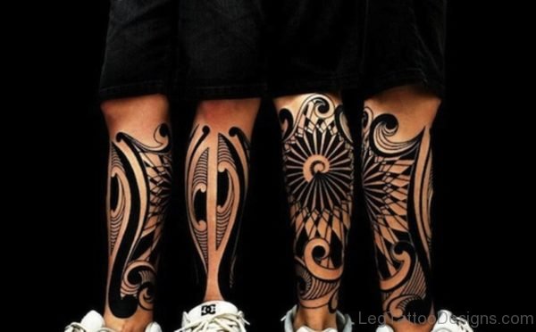 Black Inked Tribal Tattoo On Leg