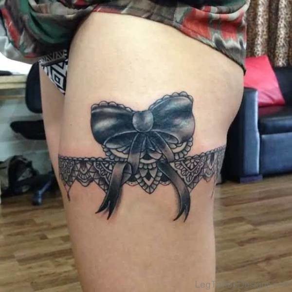 Black Lace Bow Tattoo On Thigh
