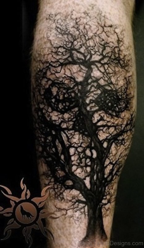 Black Tree Without Leaves With Skull Tattoo On Leg
