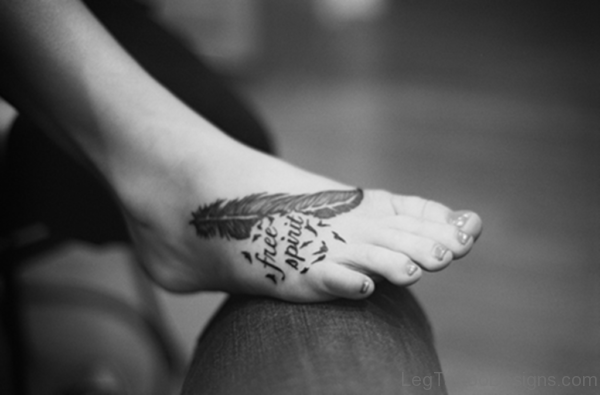 Black Word And Feather Tattoo