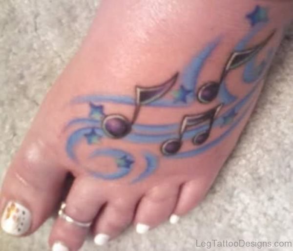 Blue Colored Musical Note Tattoo On Foot