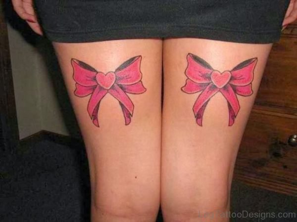 Cool Pink Bow Tattoo On Thigh