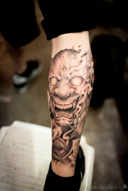 Fantastic Japanese Mask Tattoo On Leg