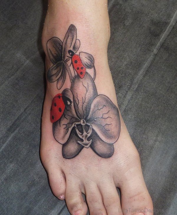 Flower And Ladybug Tattoo On Foot
