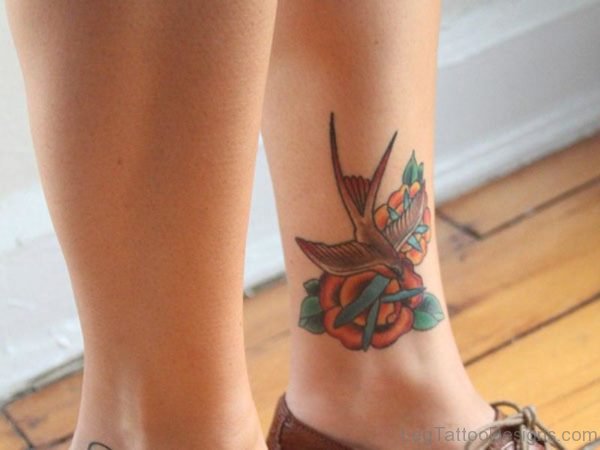 Flying Brown Bird Tattoo On Leg
