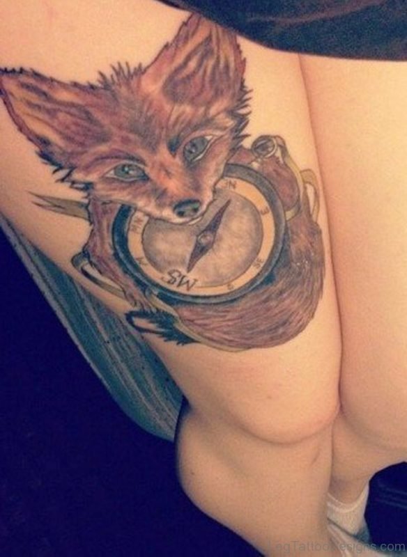 Fox And Compass Tattoo On Girl Thigh