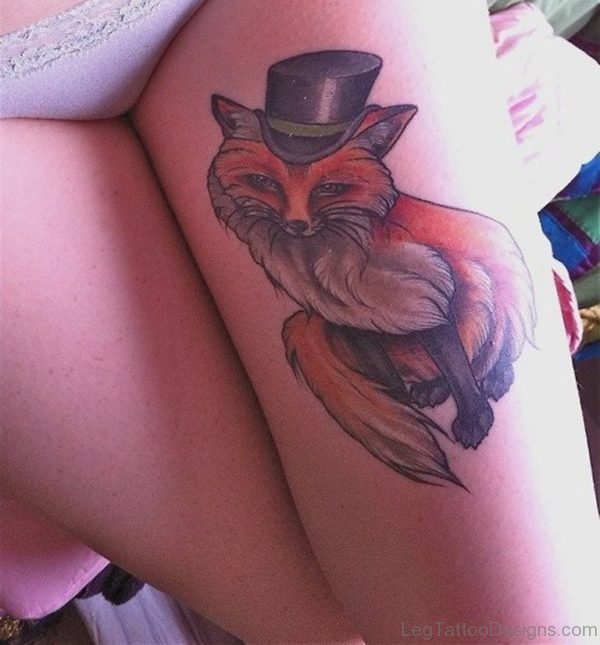 Fox With Hat Tattoo On Girl Thigh