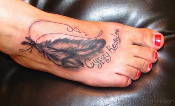 Girl With Feather Tattoo On Foot