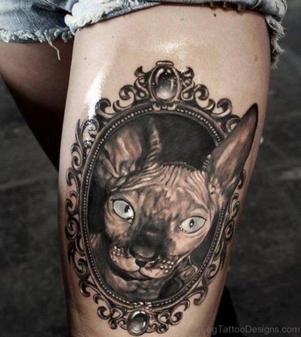 Green Eye Cat Tattoo On Thigh