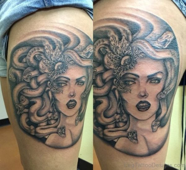 Grey Ink Medusa Face Tattoo On Thigh