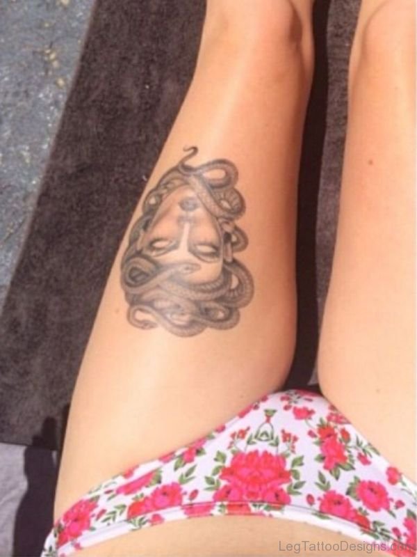 Grey Ink Medusa Tattoo On Left Thigh