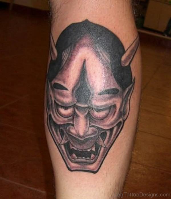 Grey Mask Tattoo On Leg
