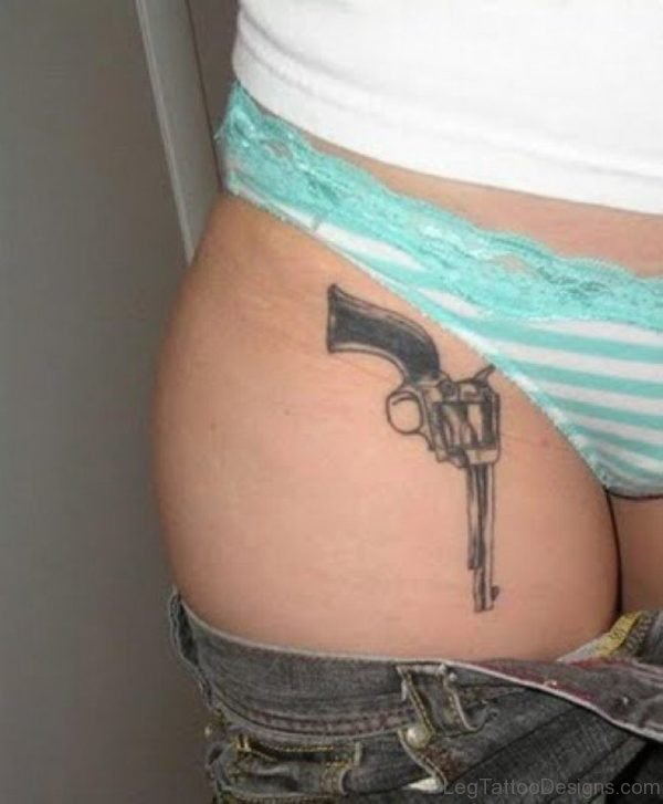 Gun Tattoo On Girl Thigh