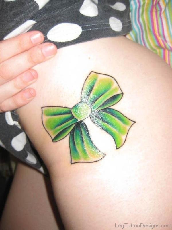 Impressive Green Bow Tattoo On Thigh