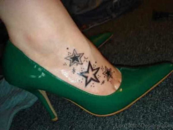 Lovely Black Stars Tattoo On Foot