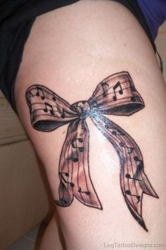 MusicalBow Tattoo On Thigh