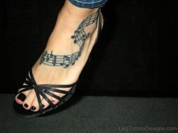 Nice Musical Tattoo On Foot 